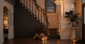 Cosy autumnal hallway with dark brown fitted storage.