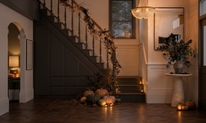 Cosy autumnal hallway with dark brown fitted storage.