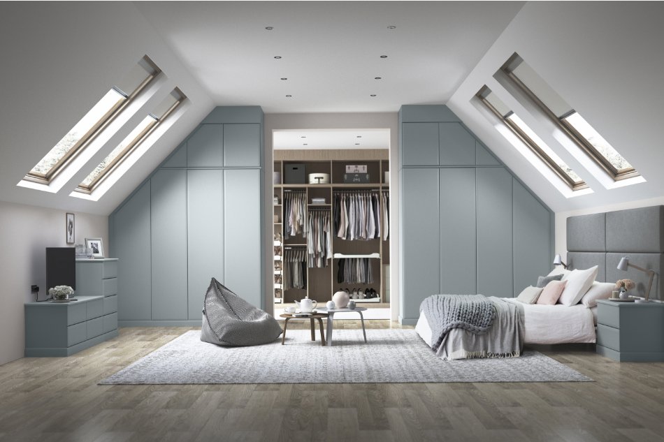 large moden bedroom with light blue fitted wardrobes