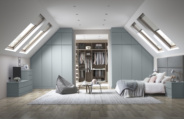large moden bedroom with light blue fitted wardrobes