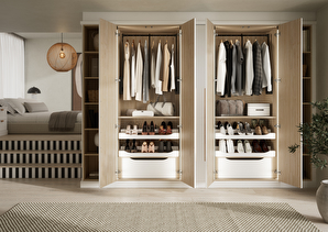 bedroom with white fitted wardrobes and stairs up to the double bed