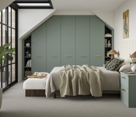 green fitted wardrobe in a modern bedroom